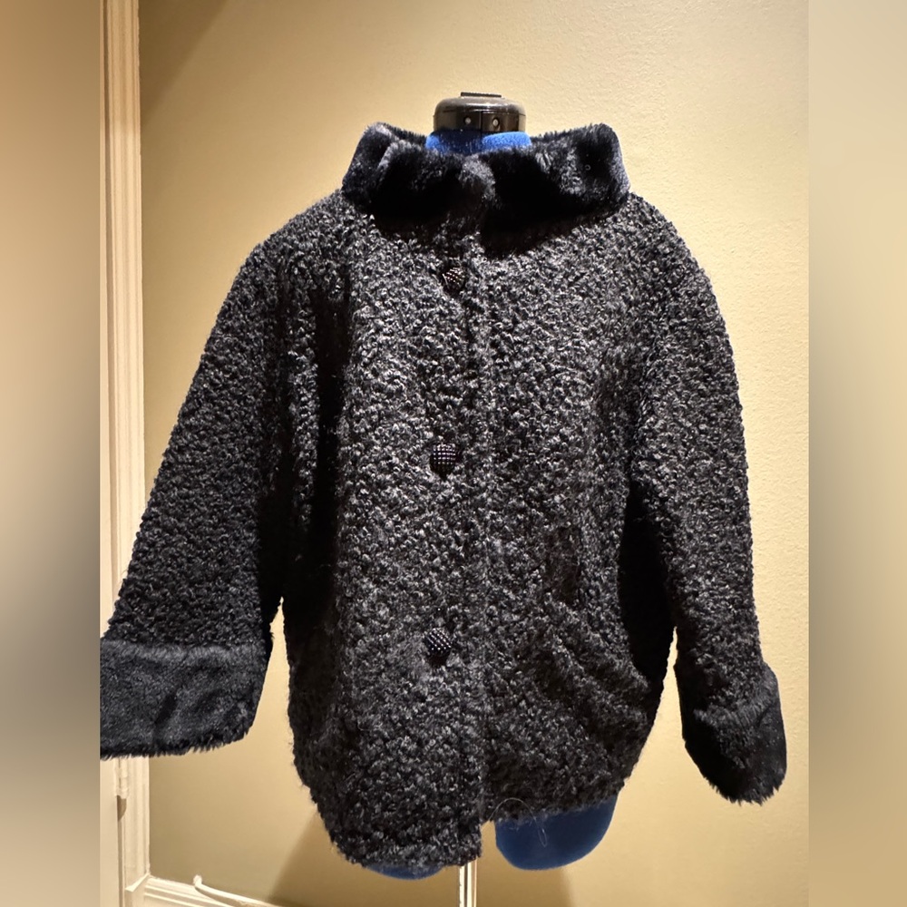 Vintage black faux mouton jacket, 3/4 length sleeves, beautifully lined.